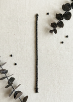 Unisex Black Diamond Tennis Bracelet 925 Silver flat lay on beige background